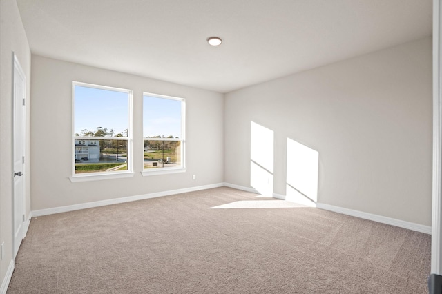 empty room featuring light colored carpet