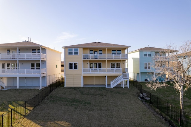 rear view of property featuring a balcony