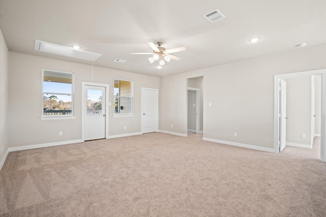 unfurnished room featuring light colored carpet and ceiling fan