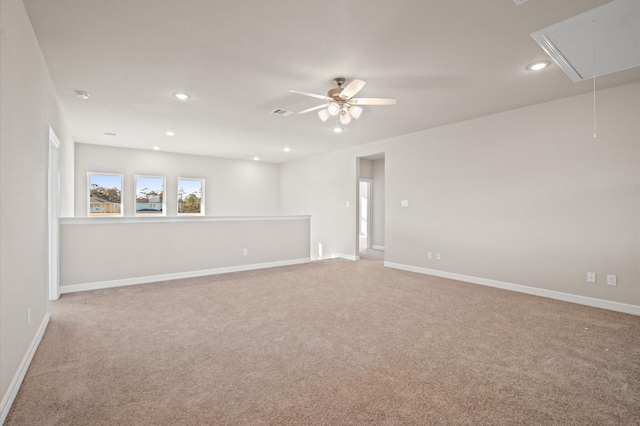 unfurnished room with ceiling fan and light carpet