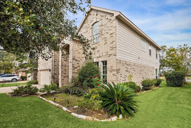 view of property exterior with a yard and a garage