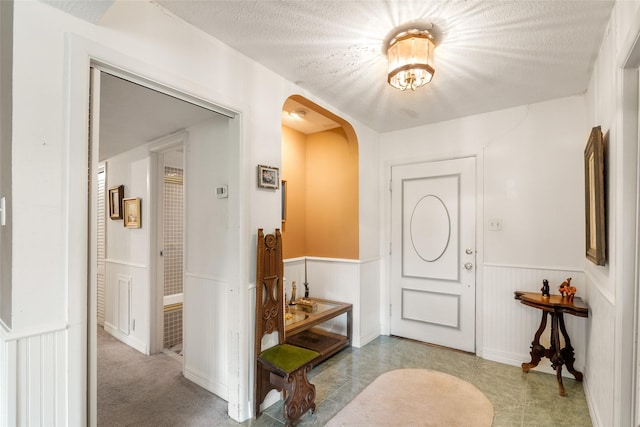 entrance foyer featuring a textured ceiling