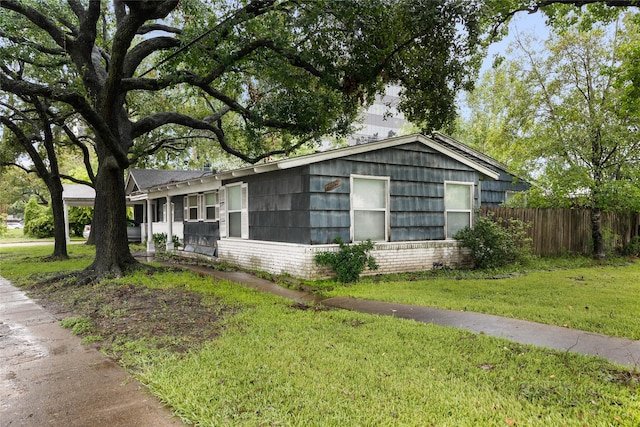 view of home's exterior with a yard