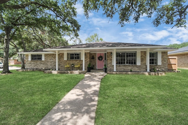 ranch-style house with a front yard and a porch