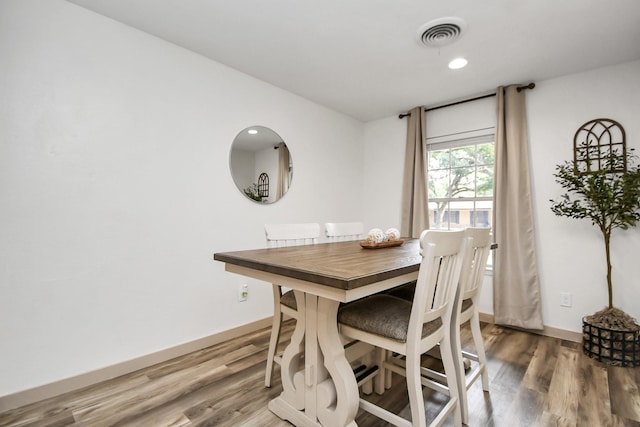 dining area featuring wood-type flooring