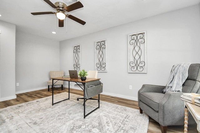 office area with hardwood / wood-style floors and ceiling fan