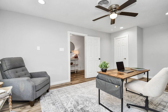 office area featuring light hardwood / wood-style floors and ceiling fan