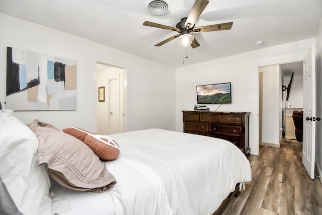 bedroom with ceiling fan and hardwood / wood-style flooring