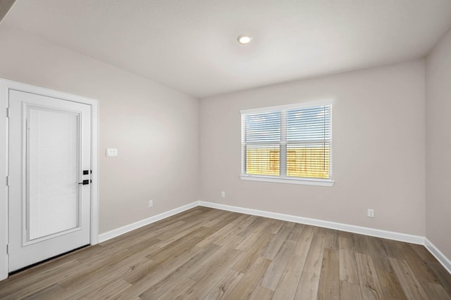 unfurnished room with light hardwood / wood-style flooring