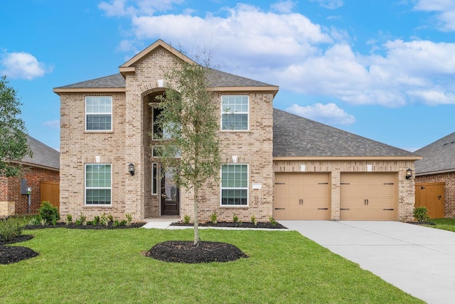 view of front facade featuring a garage and a front lawn