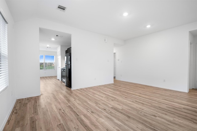 14519 Broadbury Pond Rd, Rosharon, TX 77583 - unfurnished living room with light wood-style floors, baseboards, and recessed lighting