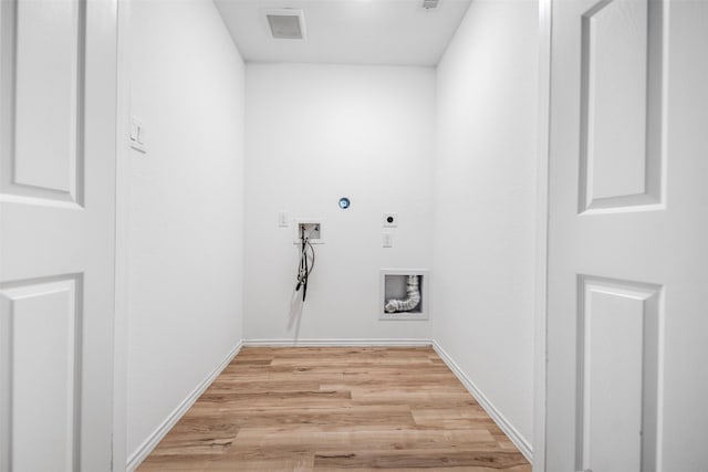 14519 Broadbury Pond Rd, Rosharon, TX 77583 - clothes washing area featuring hookup for an electric dryer, washer hookup, light wood-style floors, and baseboards
