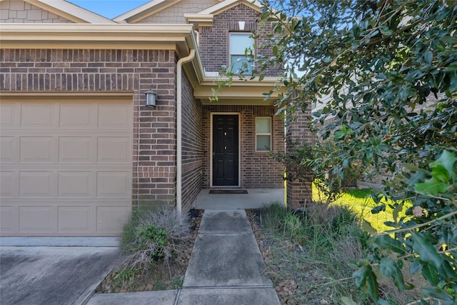 doorway to property featuring a garage