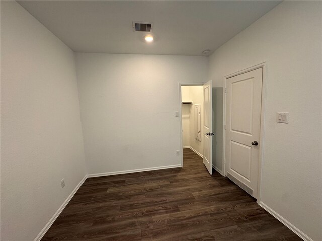 spare room with dark hardwood / wood-style floors