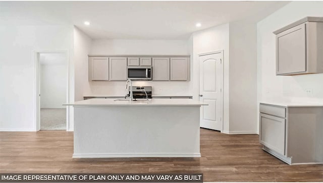40738 Rosemary Rain Ln, Magnolia, TX 77354 - kitchen featuring appliances with stainless steel finishes, gray cabinetry, a sink, light countertops, and recessed lighting