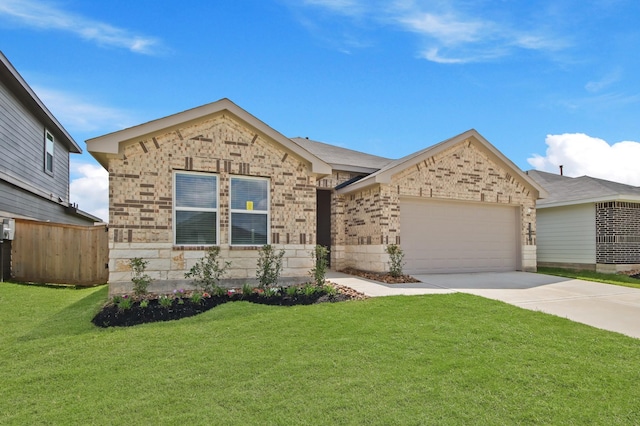 40738 Rosemary Rain Ln, Magnolia, TX 77354 - view of front of house featuring an attached garage, concrete driveway, and brick siding