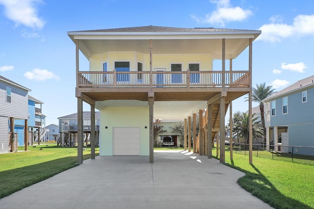 22805 Miramar Dr, Galveston, TX 77554 - raised beach house with an attached garage, driveway, a carport, a wooden deck, and a residential view
