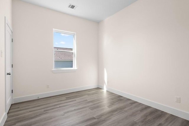 empty room with wood-type flooring