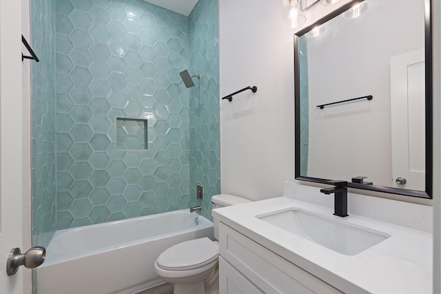 full bathroom featuring toilet, vanity, and tub / shower combination