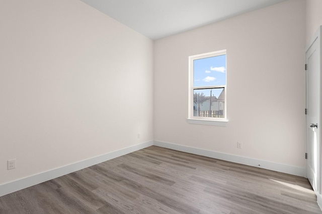 spare room with light hardwood / wood-style floors