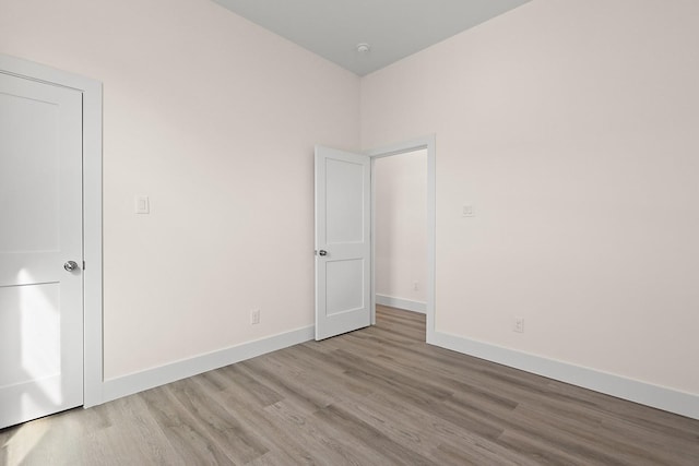 empty room with light hardwood / wood-style floors