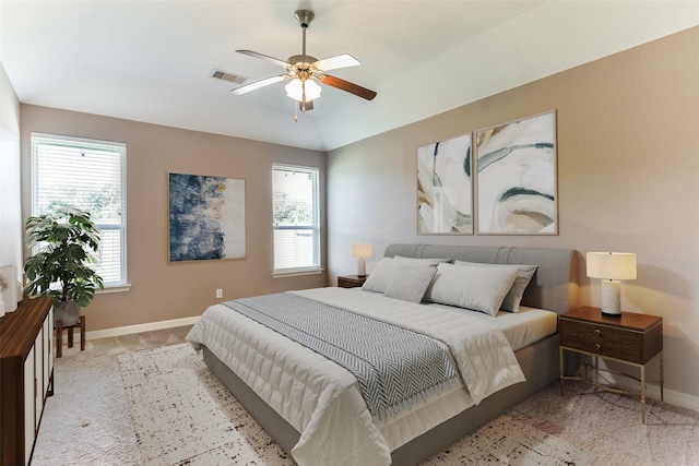 bedroom featuring ceiling fan, light carpet, and lofted ceiling