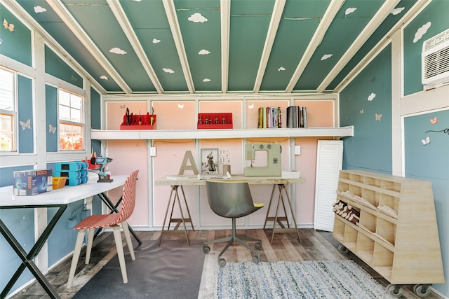 interior space with vaulted ceiling and a wall unit AC