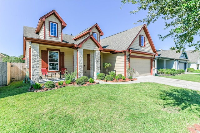 view of front of home featuring a garage, a porch, and a front yard