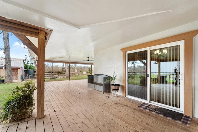 wooden terrace featuring ceiling fan