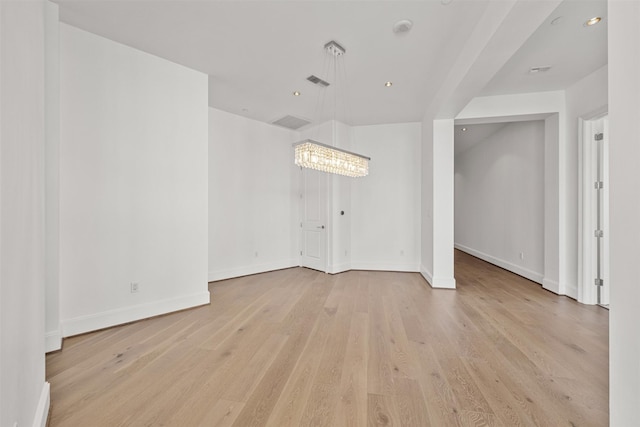 unfurnished room with light hardwood / wood-style flooring