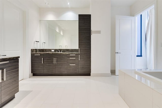 bathroom featuring tile patterned floors and vanity