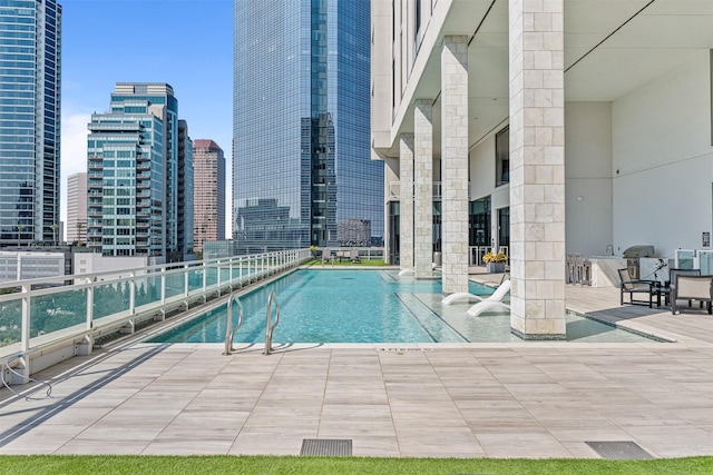 view of swimming pool with a patio area