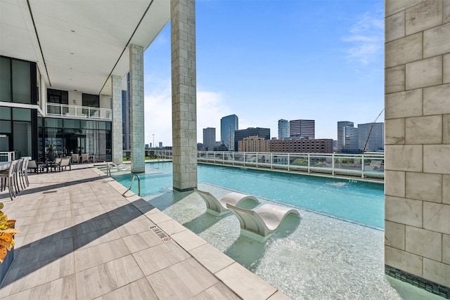 view of swimming pool with a patio