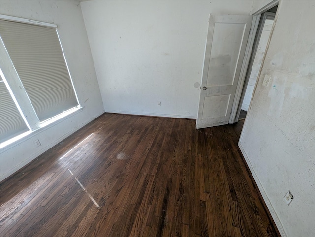 empty room with wood-type flooring