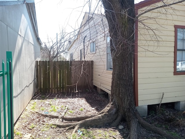 view of property exterior featuring fence