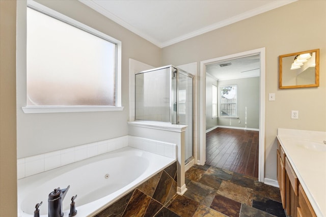 bathroom featuring vanity, separate shower and tub, and ornamental molding