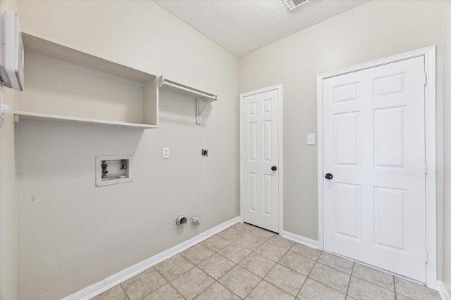 washroom featuring washer hookup, electric dryer hookup, gas dryer hookup, a textured ceiling, and light tile patterned floors