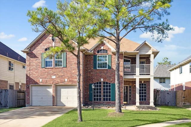 view of front of home featuring a balcony, a front lawn, and a garage