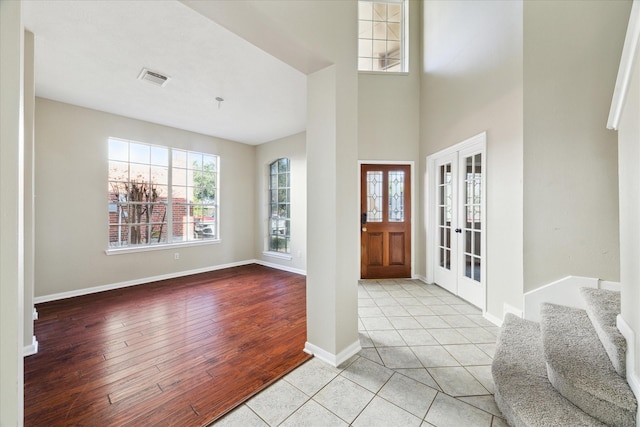 tiled foyer entrance featuring french doors