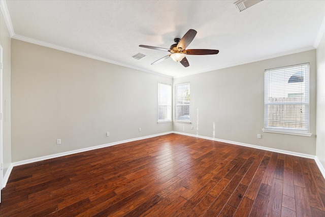 empty room featuring ceiling fan, dark hardwood / wood-style floors, and ornamental molding