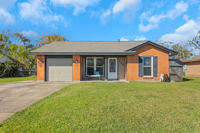 ranch-style home featuring a garage and a front yard