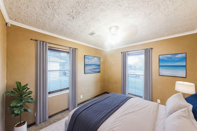 carpeted bedroom with crown molding and a textured ceiling