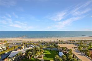 bird's eye view featuring a water view and a view of the beach