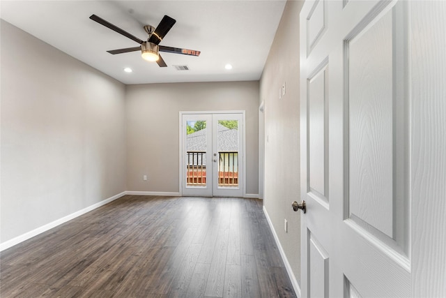 spare room featuring dark hardwood / wood-style floors, ceiling fan, and french doors