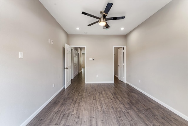 unfurnished bedroom featuring ceiling fan and dark hardwood / wood-style floors