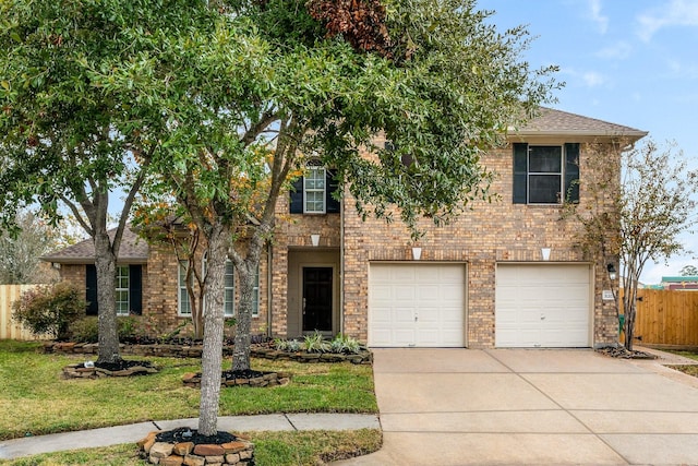 view of front of house with a front yard and a garage