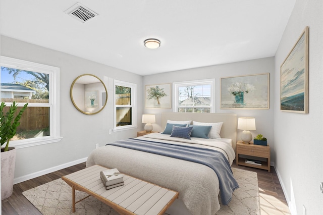 bedroom featuring dark hardwood / wood-style flooring