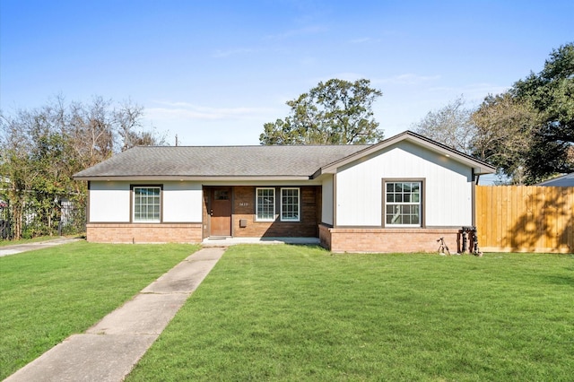 ranch-style house with a front lawn