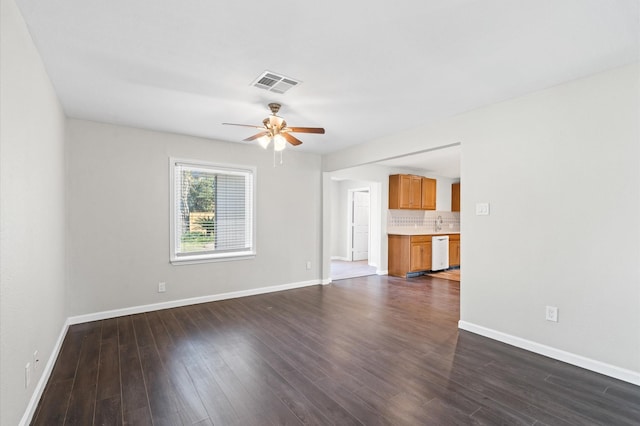 unfurnished living room with ceiling fan and dark hardwood / wood-style floors