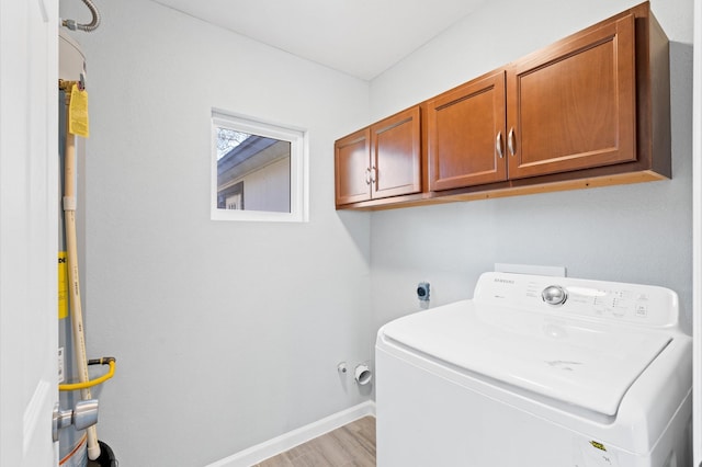 laundry room with cabinets, washer / clothes dryer, and light hardwood / wood-style flooring